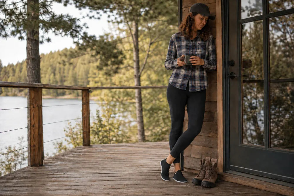 Traveler on a cottage deck in black COOPS Low Tops.