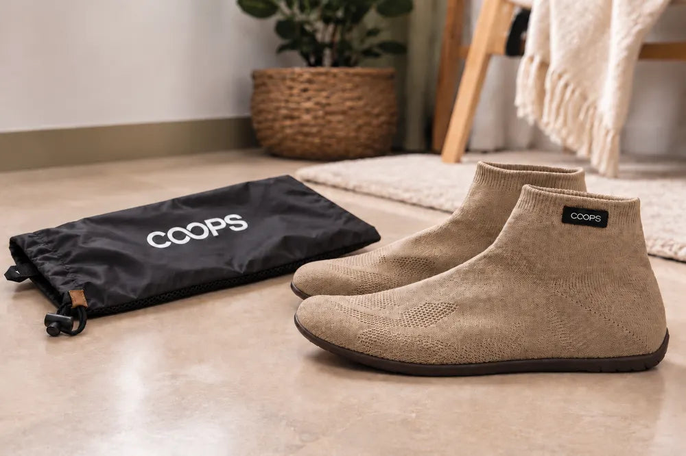 Sand COOPS High Tops beside the black COOPS wash bag.