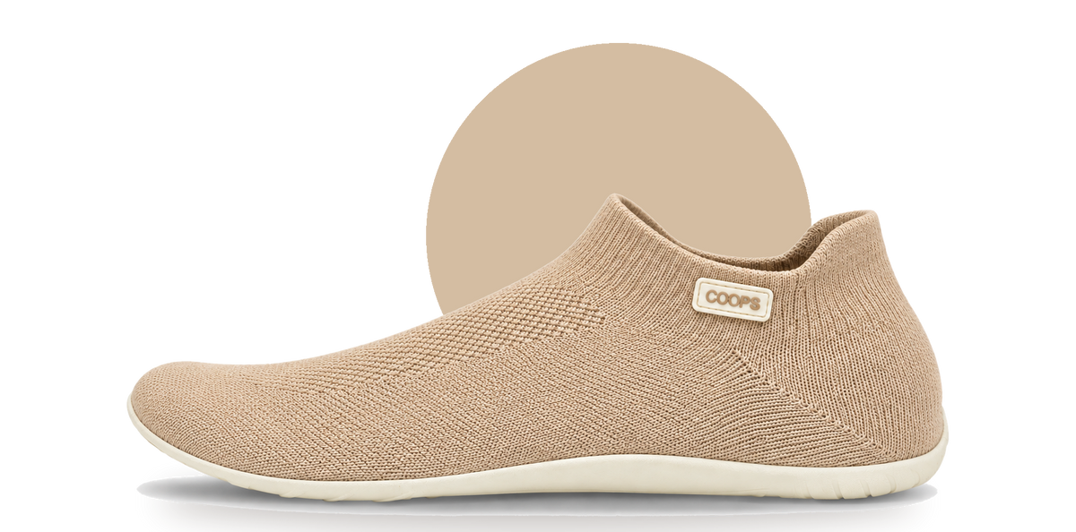 Side profile of a Sand COOPS low top sock shoe on a white background