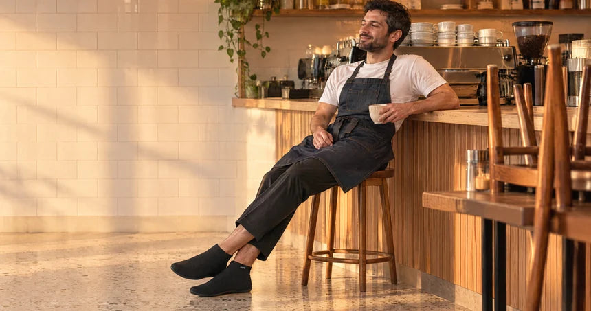 Person changing into COOPS after standing all day