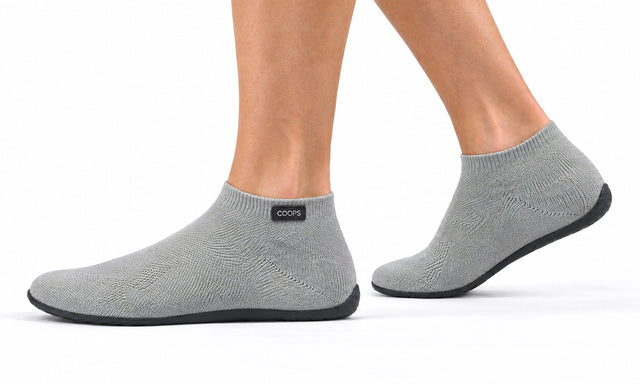 COOPS High Top in Ash Gray, worn by a woman, walking