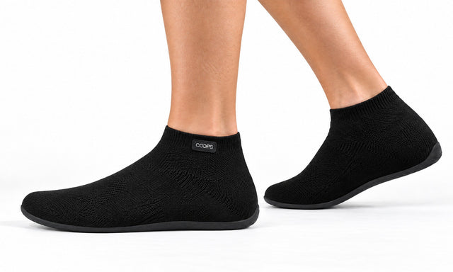 COOPS High Top in Black, worn by a woman, walking