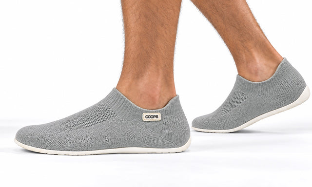 COOPS Low Top in Ash Gray, worn by a man, walking
