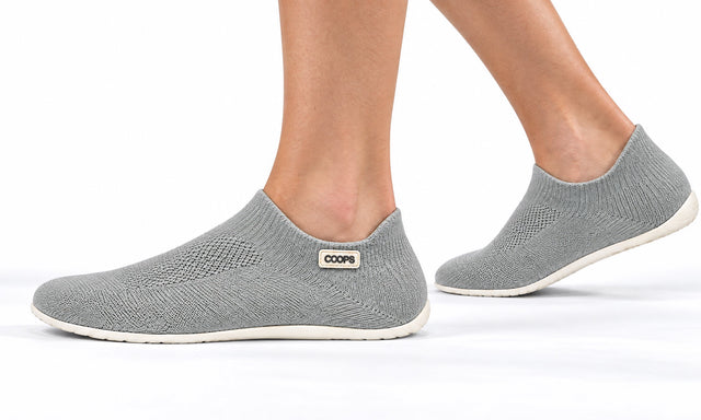 COOPS Low Top in Ash Gray, worn by a woman, walking