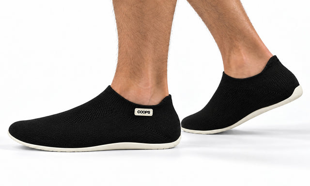 COOPS Low Top in Black, worn by a man, walking