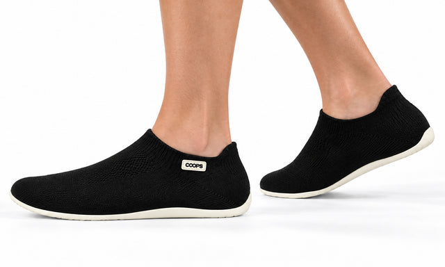 COOPS Low Top in Black, worn by a woman, walking