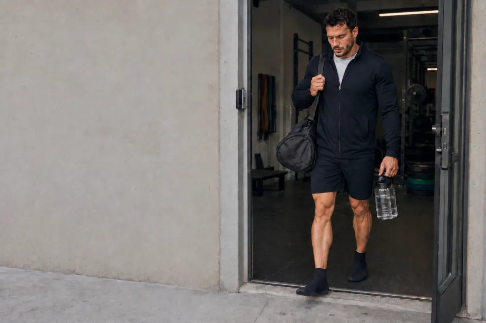 Athlete leaving the gym in black COOPS High Tops.