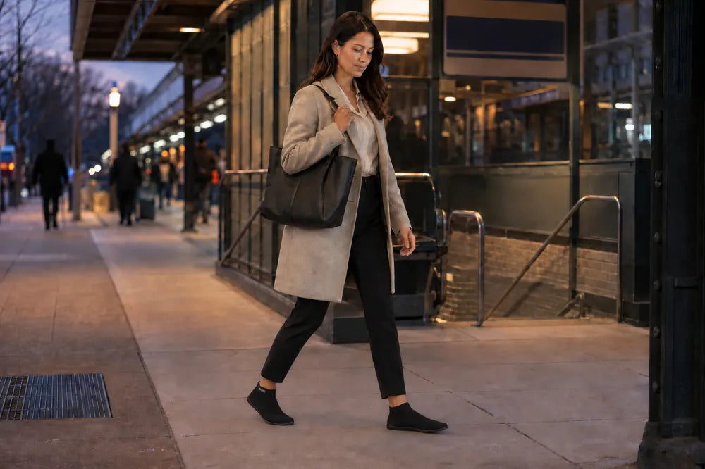 Commuter walking to the station in black COOPS High Tops.