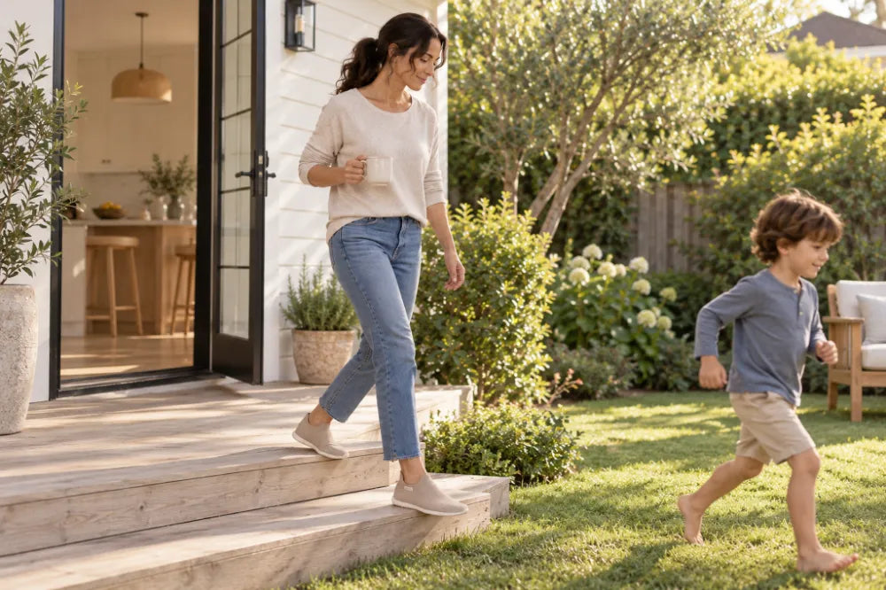 Parent stepping into the backyard in sand COOPS Low Tops.