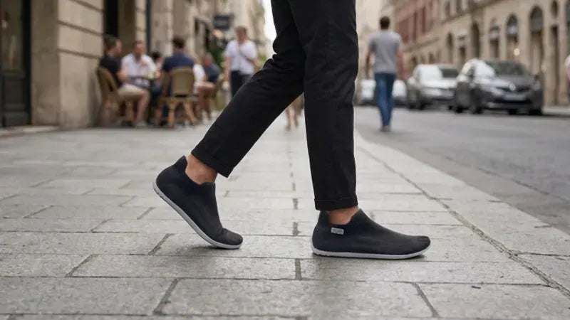 Walking down a city street in black COOPS